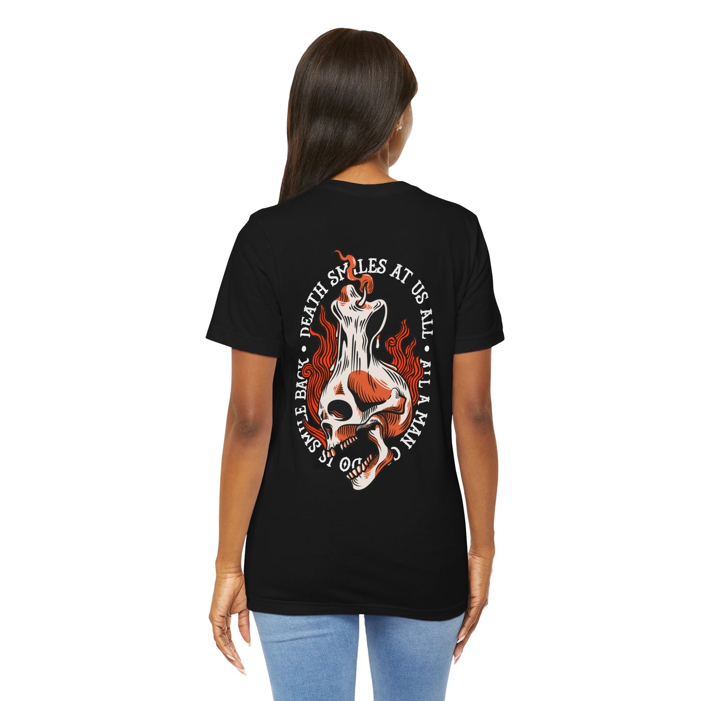 Black t-shirt with a graphic design on the back, worn by a person.